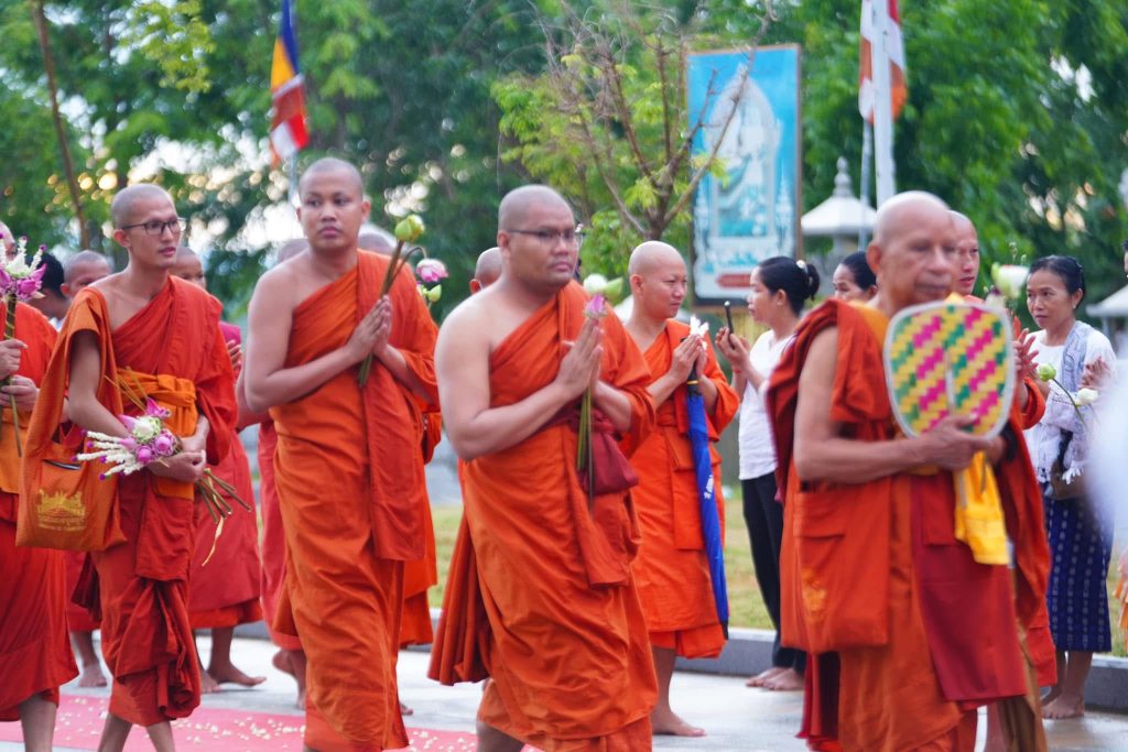 Buddhist monks walking together during a Buddhist ceremony