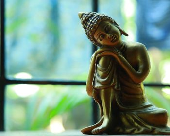 Seated Buddha statue in meditation posture