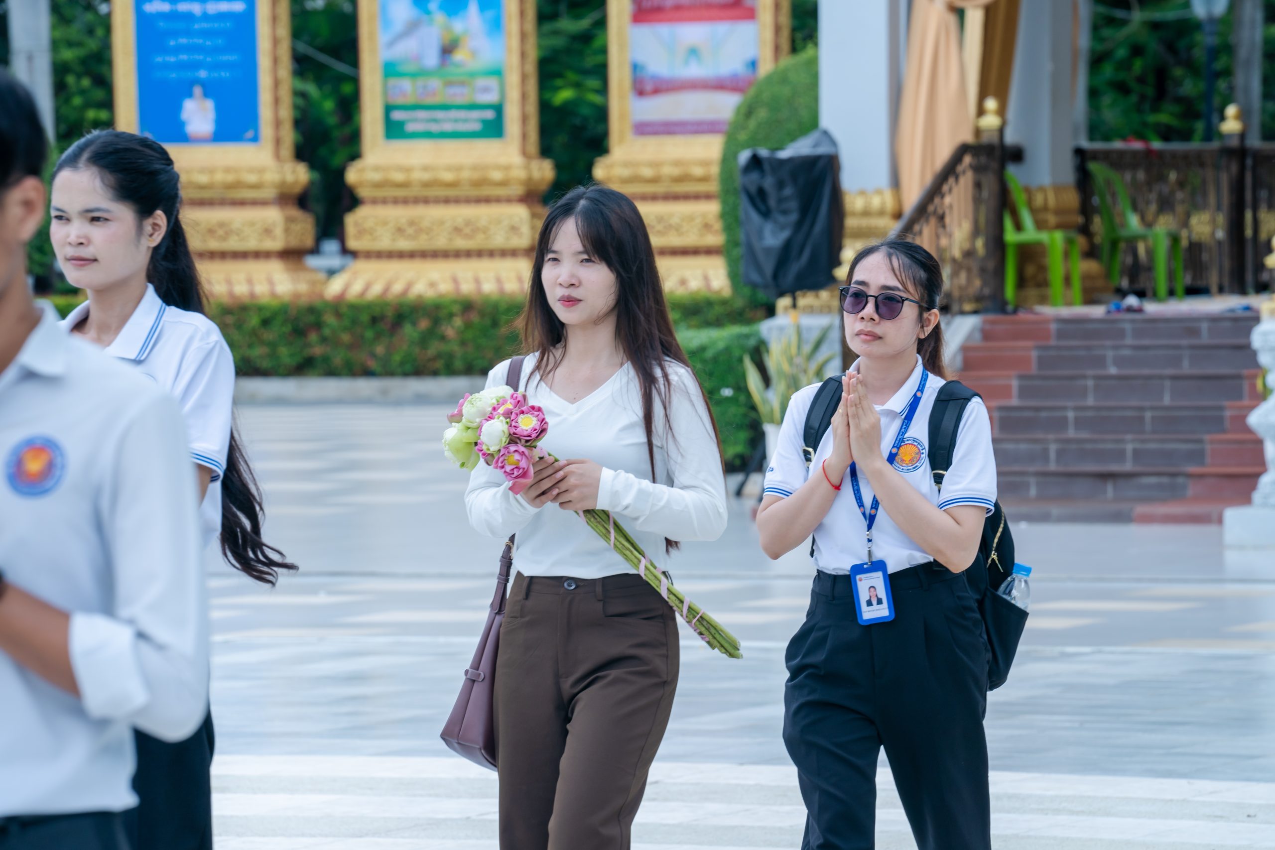 Visitors and community members taking part in a Cambodian cultural gathering