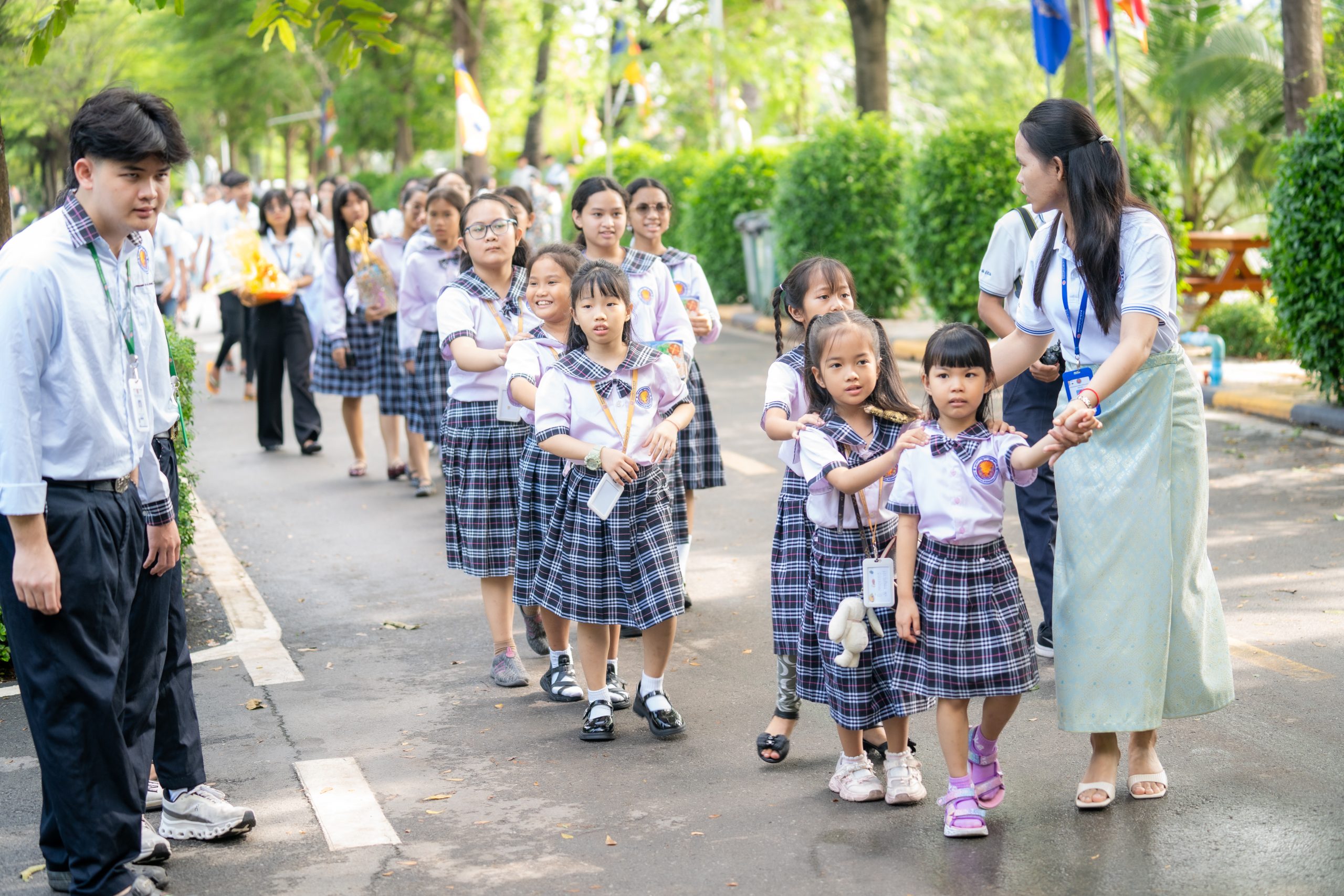 Students and community members visiting a pagoda together