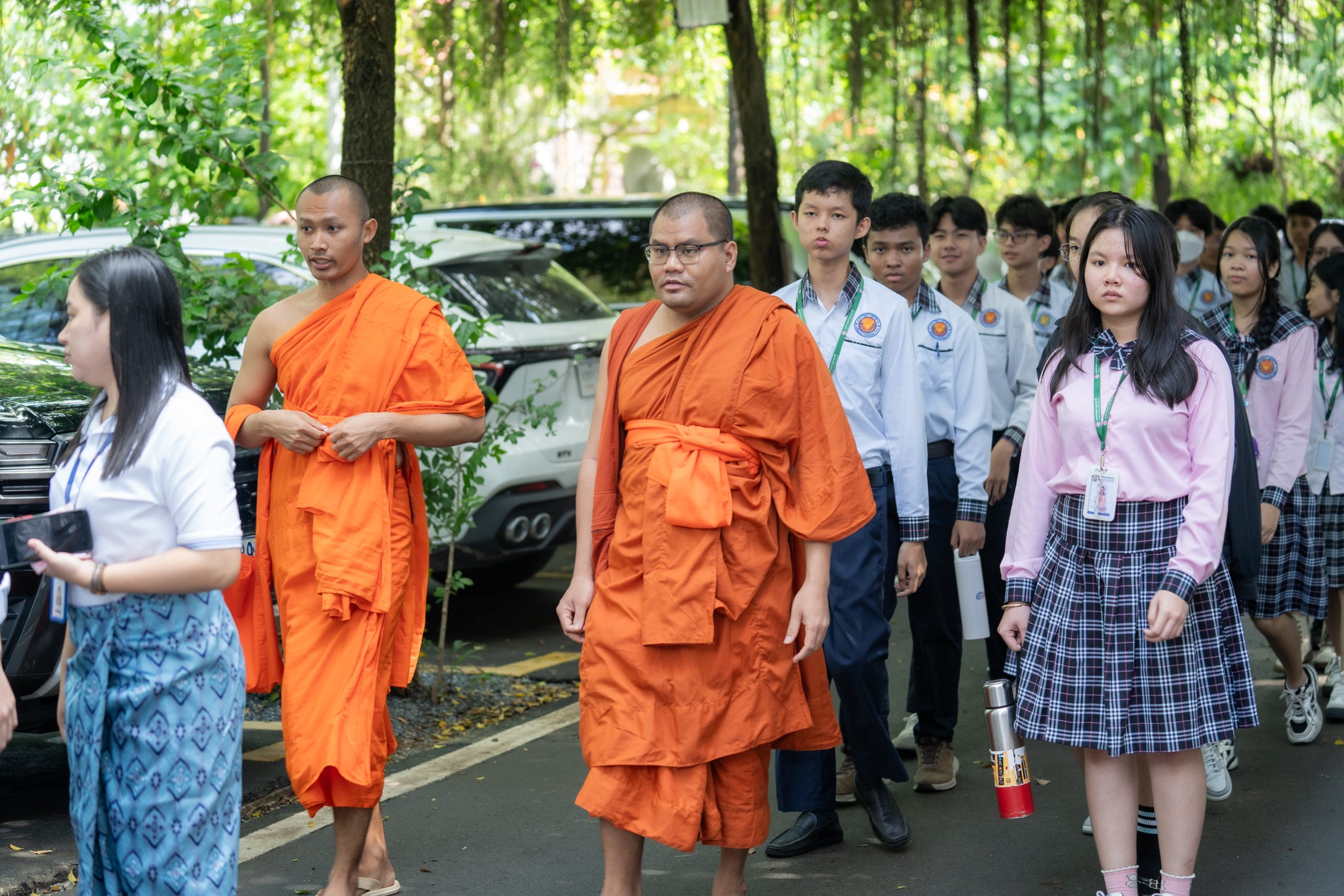 Monks accompanying students on a visit to a Cambodian pagoda