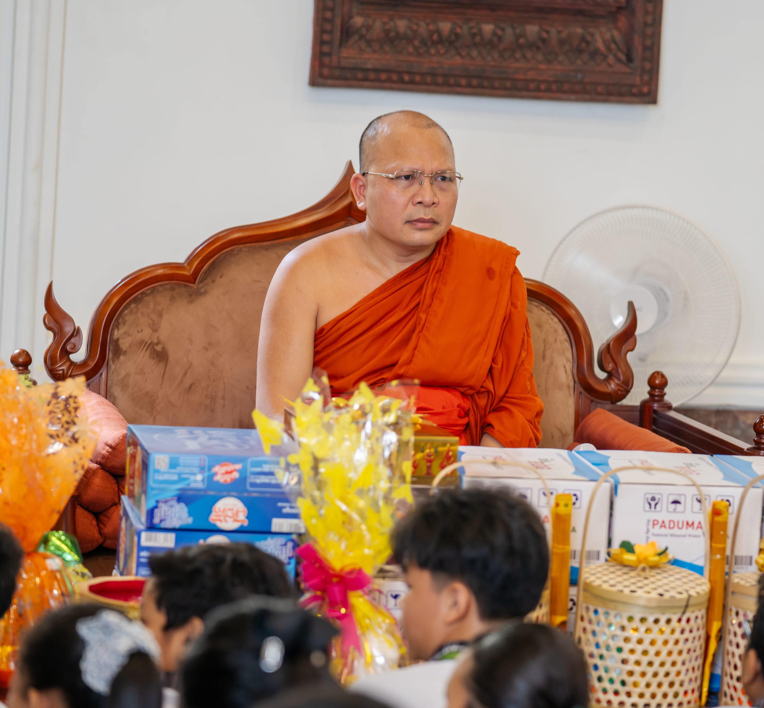 Cambodian Buddhist monk seated during a community religious gathering